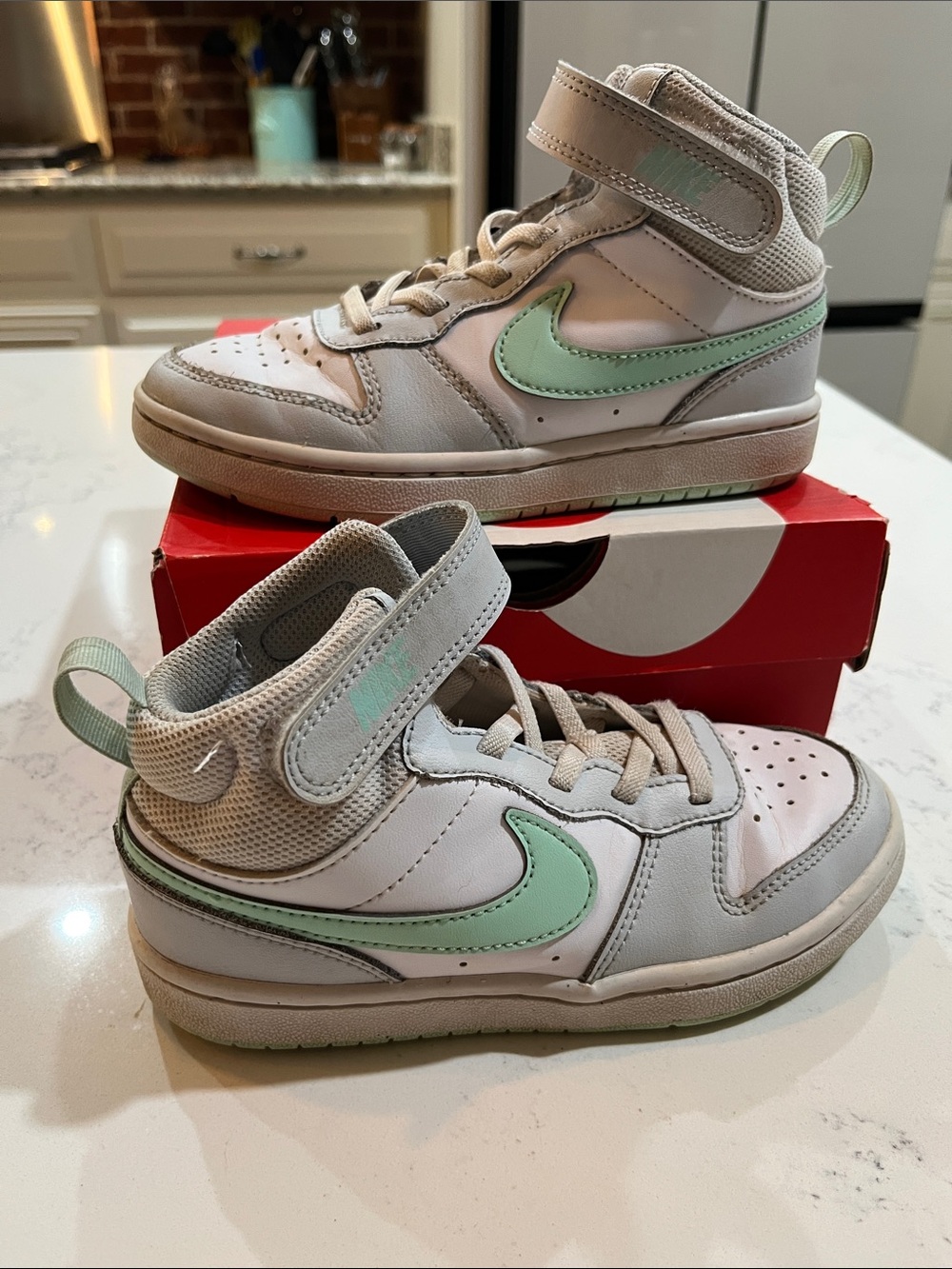 Nike Kids Mid-Top Sneakers in White with Mint Swoosh
